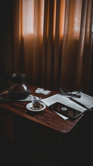 Coffee table with cup of coffee and a book on it